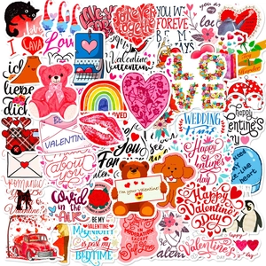 Close-up of pink Valentine stickers featuring hearts, bears and romantic text patterns