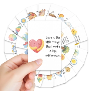 Close-up of inspirational cards with colorful hand-drawn icons and positive quotes