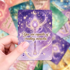Inspirational purple oracle card featuring golden staff and starry celestial motifs