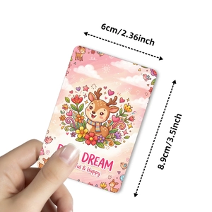 Detailed view of a cute cartoon deer decorative card with pink clouds and Dream text