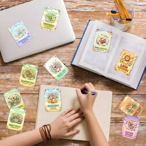 Close-up of cute animal stickers featuring dinosaurs and koalas on notebooks
