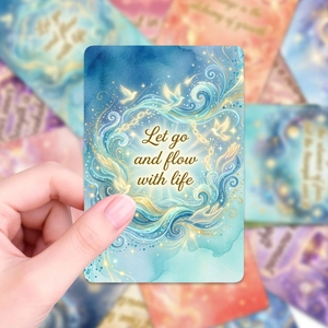 Detail of colorful oracle cards with watercolor art and inspirational English quotes