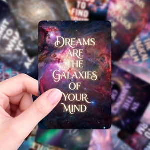 Macro detail of dreamlike galaxy card with inspirational quote and rounded corners