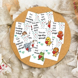 Close-up of cute cartoon animal inspirational cards with colorful heart patterns and puns