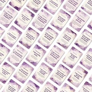 Detailed view of daily reminder cards featuring elegant purple and gold watercolor accents