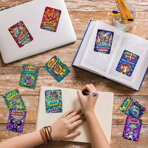 Detailed view of colorful retro pop art motivational postcards on a wooden desk setup