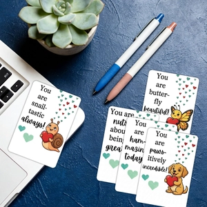 Detail of five motivational animal cards with puns displayed on a blue workspace background
