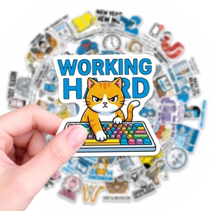 Funny 'Working Hard' angry cat sticker on mechanical keyboard for office humor