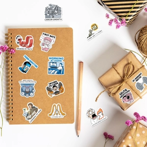Detailed view of sarcastic humor stickers on notebook and gift box with floral accents
