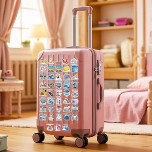 Funny internet meme stickers applied on a pink suitcase in a cozy bedroom setting