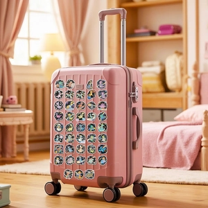 Waterproof cartoon space dinosaur stickers applied on a pink suitcase for DIY decoration