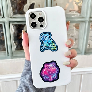 Neon cartoon animal stickers on white phone case featuring a blue parrot and pink hippo