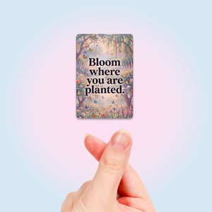 Detail of Monet style garden card with Bloom Where You Are Planted quote and hand gesture