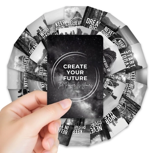 Close-up of black and white landscape cards featuring white motivational English quotes
