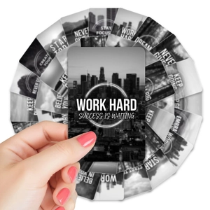 Close-up of black and white inspirational cards with motivational quotes in a fan layout