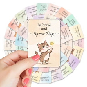 Close-up of cute watercolor cat cards with motivational English quotes for children