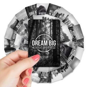 Macro detail of black and white inspirational cards with forest landscape and Dream Big text