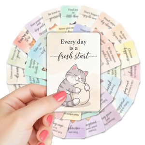 Macro shot of 36 watercolor cat motivational cards with positive quotes for kids