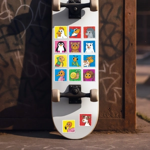 Detailed view of colorful cartoon animal stickers applied to a white skateboard deck