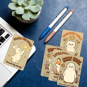 Macro shot of 18 cartoon animal motivational cards on a desk for gift decoration