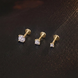 Detail view of gold-plated S925 silver labret studs with cubic zirconia and S925 hallmark