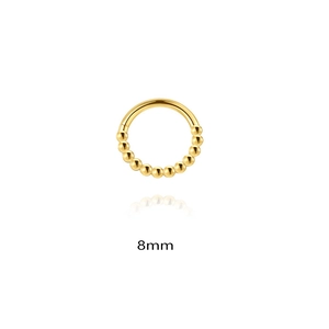 Macro detail of gold S925 silver 8mm piercing ring with decorative bead accents