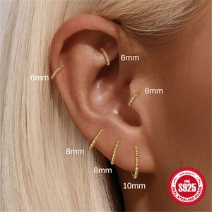 Classic S925 sterling silver beaded gold hoop earrings shown in various sizes on ear