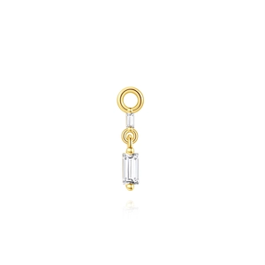 Detailed macro of gold S925 silver earring charm with baguette-cut stones and bead finish