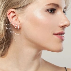 Detail showing set of four 925 silver huggie earrings in sizes 6mm, 7mm, 8mm and 9mm