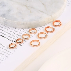 Detail of seven rose gold S925 silver hoop earrings with zircon paving and S925 hallmark