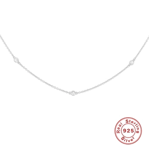 Close-up of S925 sterling silver clavicle necklace with bezel-set round clear gemstones