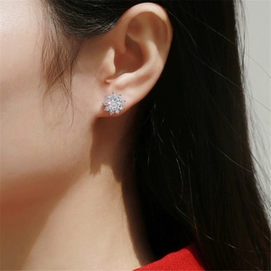 Elegant S925 sterling silver sunflower moissanite stud earrings shown on model