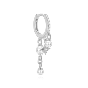 Detail of silver drop earring with pearls and star charm featuring white zircon stones