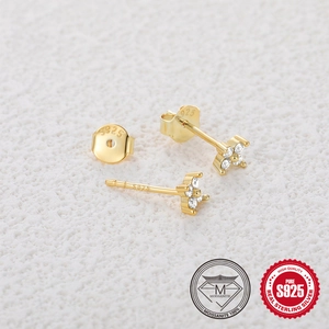 Close-up of S925 sterling silver gold flower stud earrings with moissanite crystals
