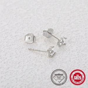 Detail of S925 sterling silver flower earrings with brilliant moissanite stones and hallmarks