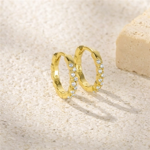 Close-up of S925 sterling silver gold-plated hoop earrings with white zircon accents