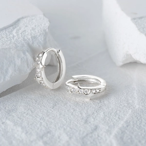 Close-up of S925 sterling silver hoop earrings with star shape and crystal stones