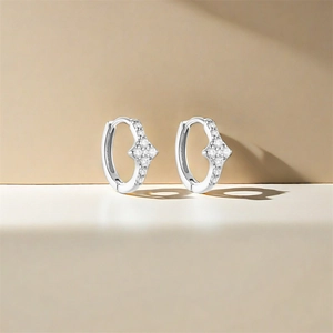 Close-up of S925 sterling silver hoop earrings with four sparkling zircon stones