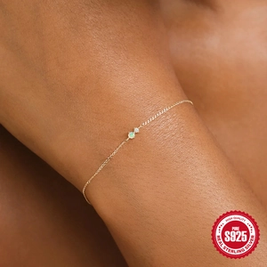 Detailed view of dainty gold S925 sterling silver chain with opal and zircon stone
