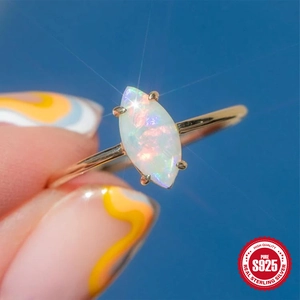 Elegant S925 sterling silver ring featuring a marquise cut opal stone with fiery colors