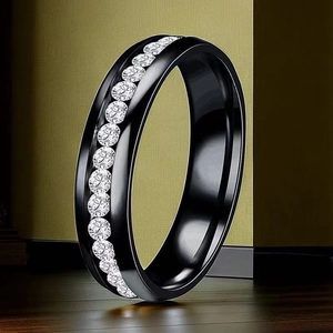 Macro detail of black titanium steel ring featuring a single row of inlaid zircon crystals