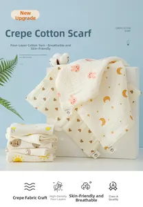 Detail of four-layer cotton gauze baby towel with cute animal and fruit prints