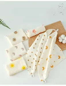 Detail of soft 100% cotton baby muslin washcloths with prints and hanging loops