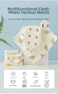 Detail showing soft cotton gauze baby towel with cute bear and rainbow cartoon patterns