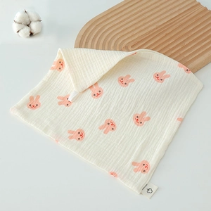Detail of pure cotton gauze baby towel with rabbit print and hanging loop for easy storage
