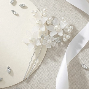 Elegant bridal hair pin with white acrylic flowers and pearls for wedding hairstyles