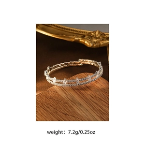 Macro shot of luxurious silver-tone bracelet with sparkling marquise-cut cubic zirconia crystals