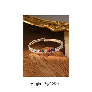 Detail of silver double-layered open bangle with colorful zircons and weight annotation