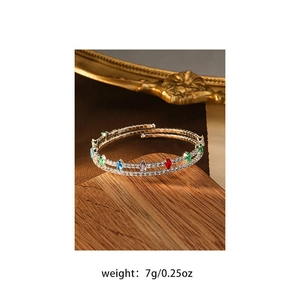 Detail of a double-layered spiral bracelet featuring colorful zircons and pearls, weight 7g