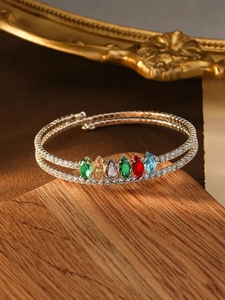 Detail of multi-row silver bracelet featuring marquise-cut colorful zircon and pearls